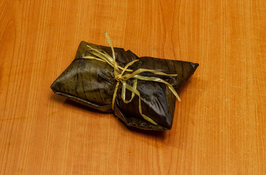 Nacatamal typical Nicaraguan food, corn, meat, butter, potatoes, onion, wrapped banana leaf