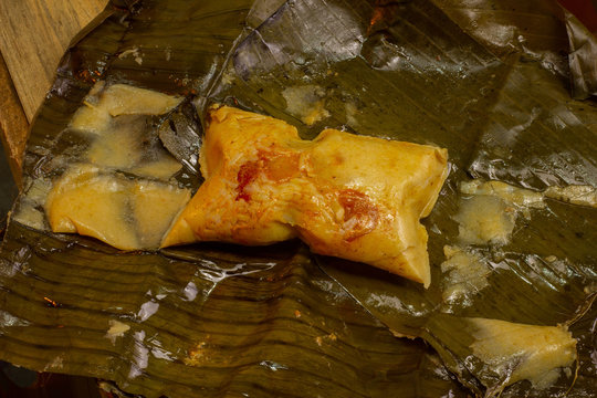 Nacatamal typical Nicaraguan food, corn, meat, butter, potatoes, onion, wrapped banana leaf