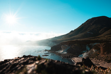 sunset on coast of sea