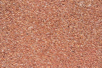 abstract scene of the wall texture in red colour with small grain rocks