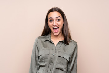 Young girl over isolated background with surprise facial expression