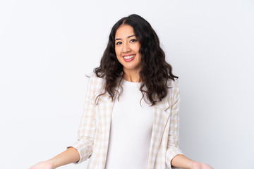 Fototapeta premium Mixed race woman over isolated white background smiling