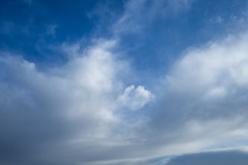 Blue sky background with tiny stratus cirrus striped clouds. Clearing day and Good windy weather