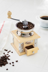 coffee bean grinder on white table