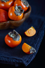 persimmon on a dark background