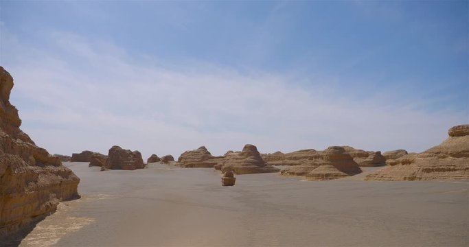 Nature landscape view of Yardang landform under sunny blue sky in Dunhuang UNESCO Global Geopark, Gansu China.