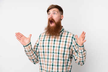Fototapeta premium Redhead man with long beard over isolated white background with surprise facial expression