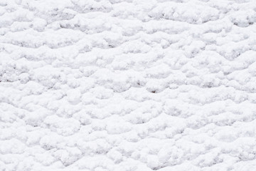 Background Of White Fluffy Snow With Pattern.