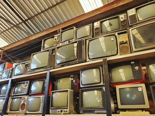 Pattern wall of pile retro television (TV) - vintage filter effect style