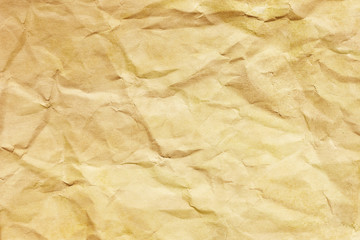 Brown crumpled paper texture. Grunge old parchment background. Stained dirty burned message backdrop for graphic design. Vintage ancient empty copy space background.