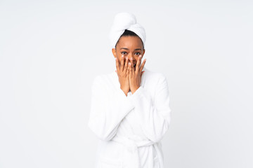 African american woman  in a bathrobe over isolated background with surprise facial expression