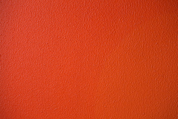 Fototapeta premium Orange or red plaster wall texture detailed close-up