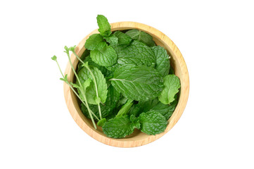 Fresh mint leaves in wood bowl isolated on white background.top view