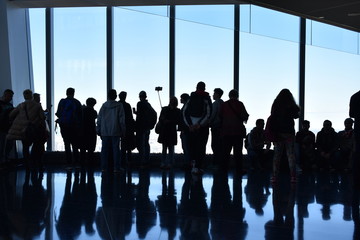 silhouettes of people in airport