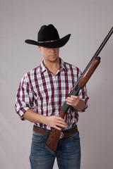 thoughtful Cowboy with a shotgun