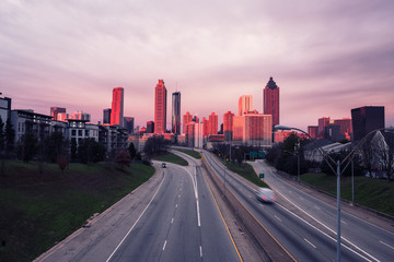 Fototapeta na wymiar Atlanta skyline and highway at sunrise, Georgia, USA