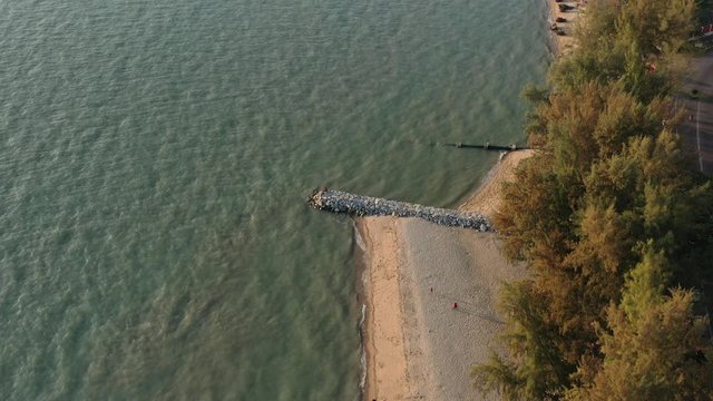 4k cinematic b-roll drone shot of flying above Pantai Puteri, famous beach at Melaka, Malaysia. 