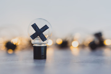 decision making, bad idea rejected and crossed out surrounded by other light bulbs lit up