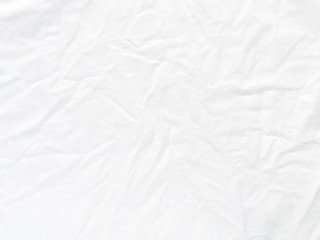Wrinkled white cotton fabric surface for background and texture.