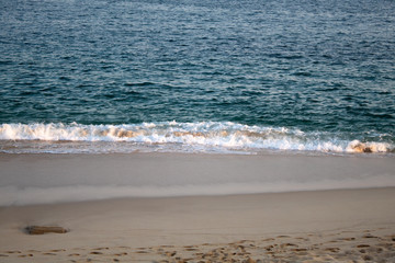 sunny beach and the clear ocean
