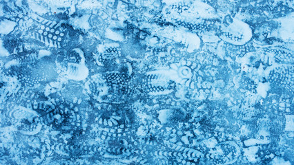 footprints on the footpath in the Park in winter