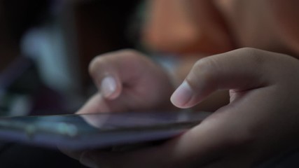 Mobile phones in hands female teenagers using looking posts on social media and chatting to friends on browsing social networks for entertainment and shopping - Powered by Adobe