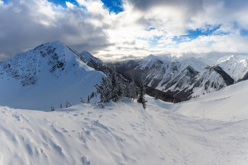 Fototapeta na wymiar Kicking Horse, Golden, British Columbia, Canada. Beautiful View of Canadian Mountain Landscape during a vibrant sunny and cloudy morning sunrise in winter.