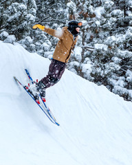 People are having fun in downhill skiing and snowboarding in the middle of snowfall 