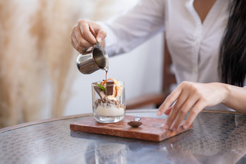 Woman pouring tea into a cup