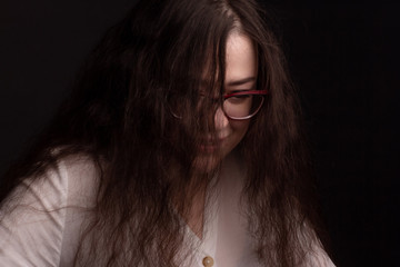 portrait of a plump brunette with long curly hair