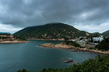 Fototapeta na wymiar Moody Weather in Shek O, Hong Kong during dark cloudy day with island landscape