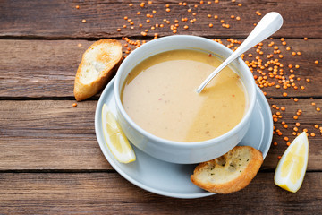 Red lentil soup served with lemon and toasted bread.
