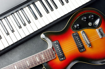 Synthesizer keyboard, electric guitar