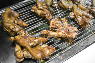 Delicious roast pig's feet on the grill
