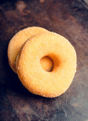 Donut with apple jam on the rustic background. Selective focus.