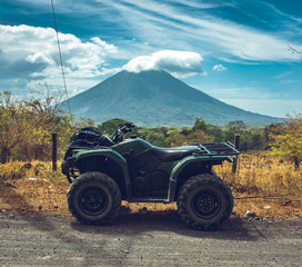 ATV and a volcano in the background