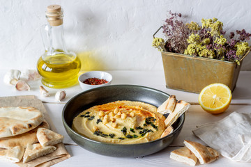 Hummus on a white background. Pete. Recipes. Vegetarian food. Healthy eating.