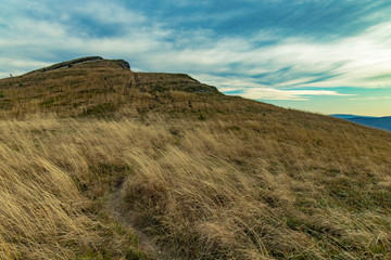 dramatic moody rocky highland plateau landscape scenic view in windy weather time and cloudy sky background space