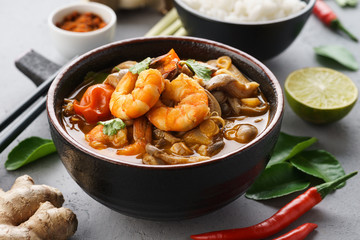 Tom Yam Kung - spicy Thai soup with shrimps. Served with rice.