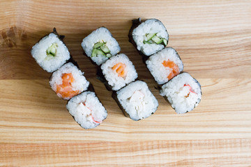 Fresh and delicious rolls, sushi and Japanese cuisine. rolls with salmon, avocado, cucumber, flying fish ROE and cream cheese inside. Sushi menu. Flatley food. the view from the top.