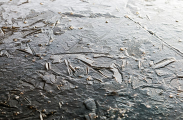 background from the structure of the frozen ice of a winter lake or pond.