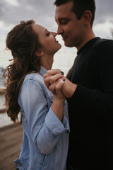 Young beautiful couple walking along the waterfront / Lifestyle