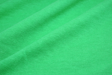 Green Mint surface cotton fabric  - Waving backdrops texture background of clothing                                