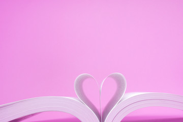 Pink Heart Shape- Create from book on Pink Background - Valentine Day - Love Concept 