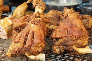Thai Food scene - Crispy pork leg in market   