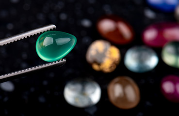 Round cut emerald mineral gemstone.