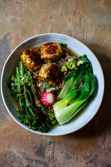 Japanese soup with soba noodles and chicken meat balls