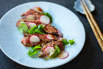 Japanese style beef tataki with radish and coriander