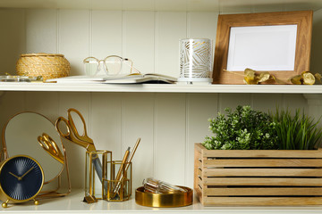 White shelving unit with different decorative elements