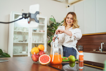 Joyful blonde woman spending her morning at home